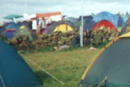 A boy tries to climb the pole out the back of our tent early morning, not with much success.